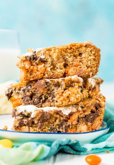 These Peanut Butter Fluff Blondies are a sweet and chewy dessert that's loaded with chocolate chips and Reese's pieces with a marshmallow swirl!