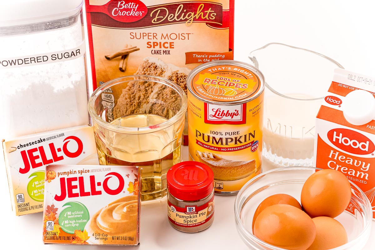 Ingredients to make pumpkin cupcakes on a white table.