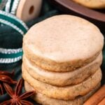 A stack of chai cookies on a green napkin.