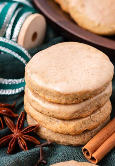 A stack of chai cookies on a green napkin.