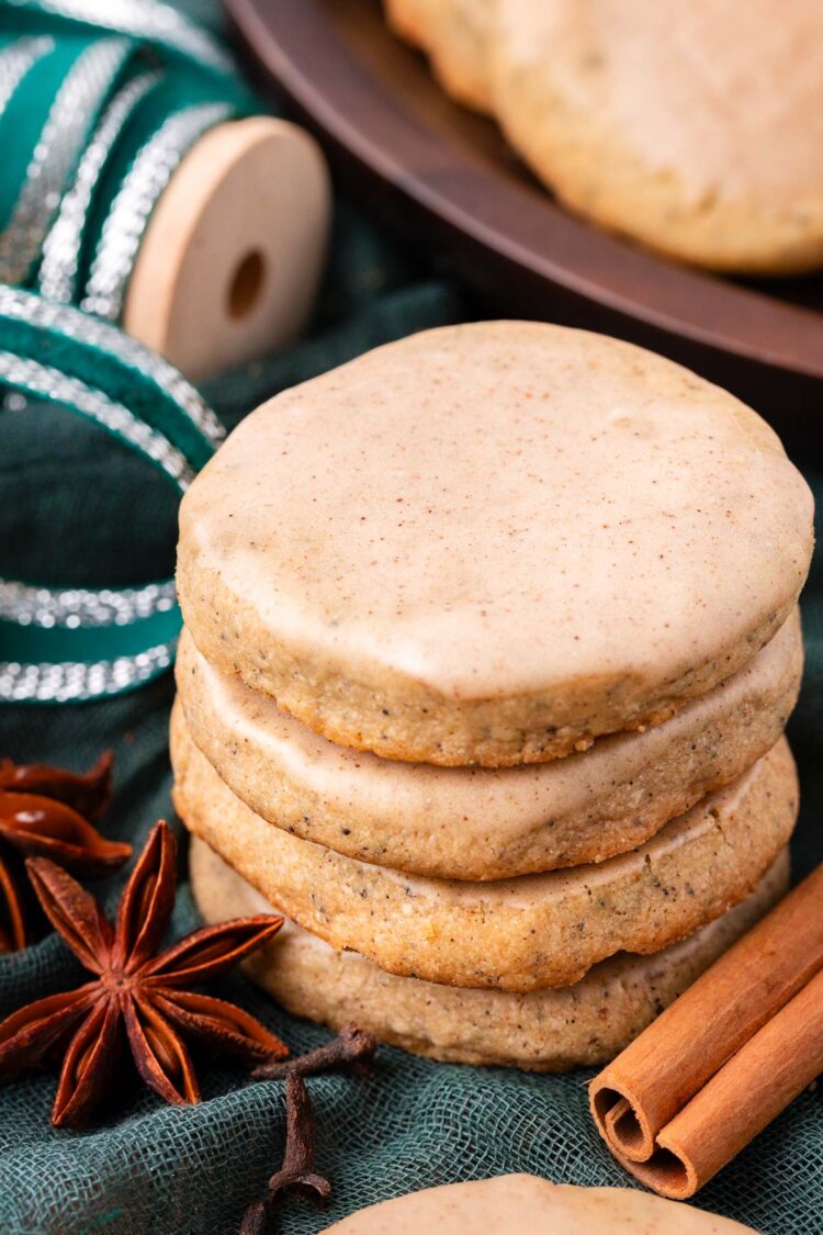 A stack of chai cookies on a green napkin.