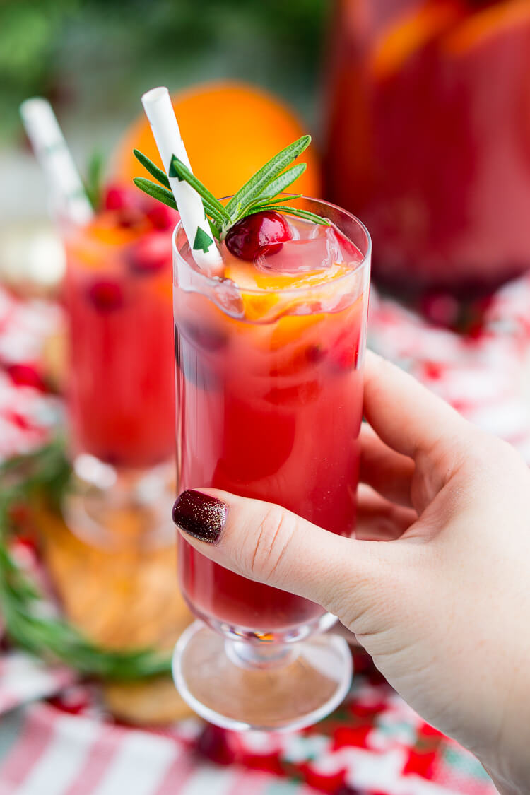 Christmas Punch is an easy and delicious holiday party drink packed with fruits like cranberries, oranges, and pomegranates. Keep it non-alcoholic or add rum or vodka for extra holiday spirit!
