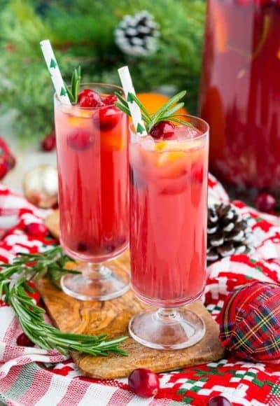 Christmas Punch is an easy and delicious holiday party drink packed with fruits like cranberries, oranges, and pomegranates. Keep it non-alcoholic or add rum or vodka for extra holiday spirit!