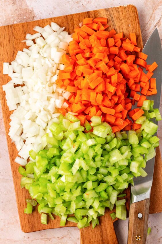 Mise en place prepped on a wooden cutting board.