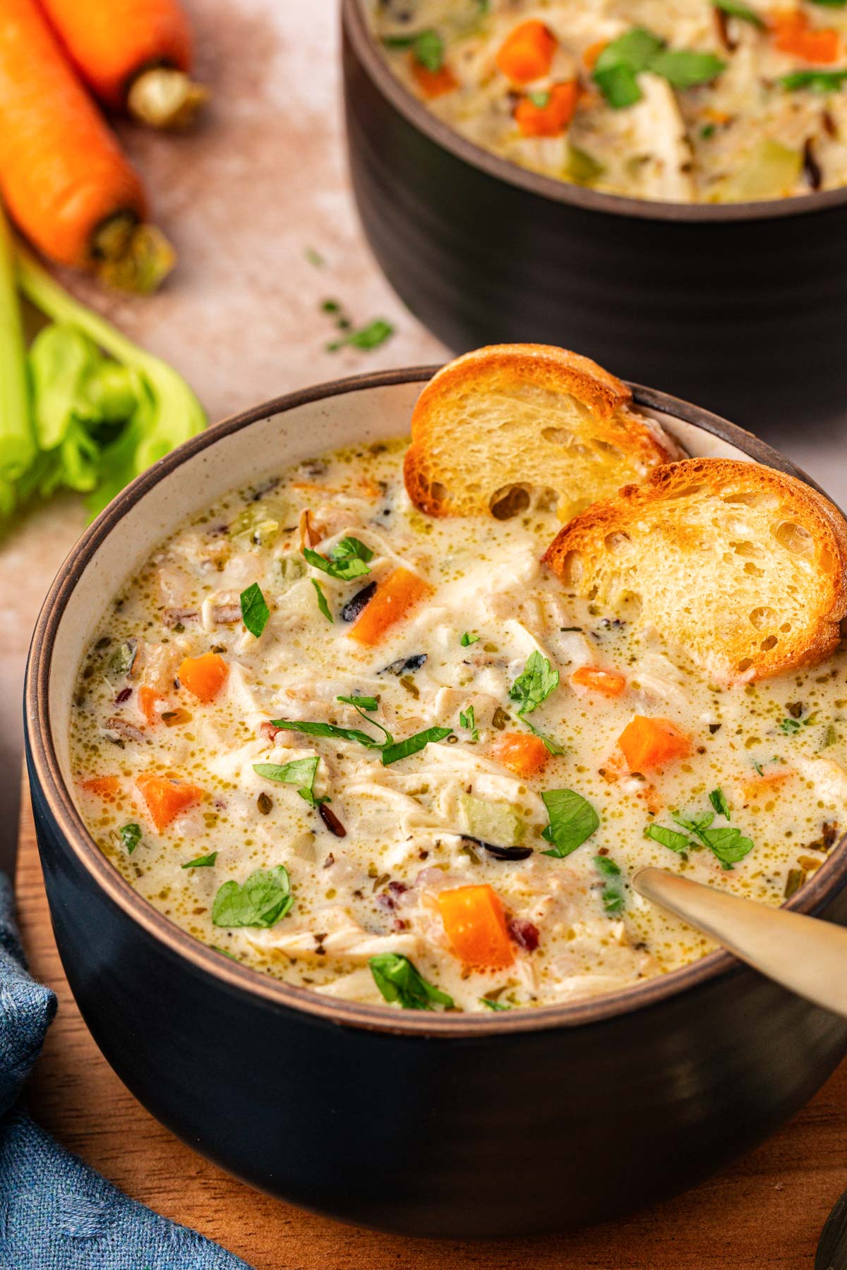 Close up of a bowl of chicken and wild rice soup.