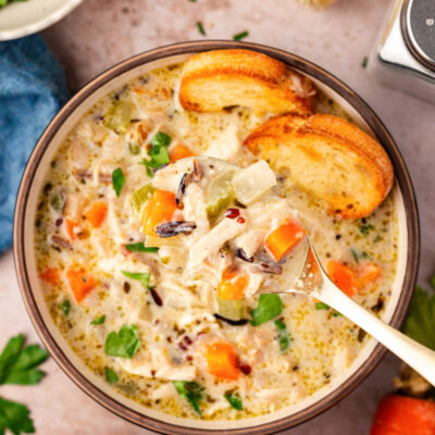 Close up overhead photo of a bowl of chicken and rice soup.