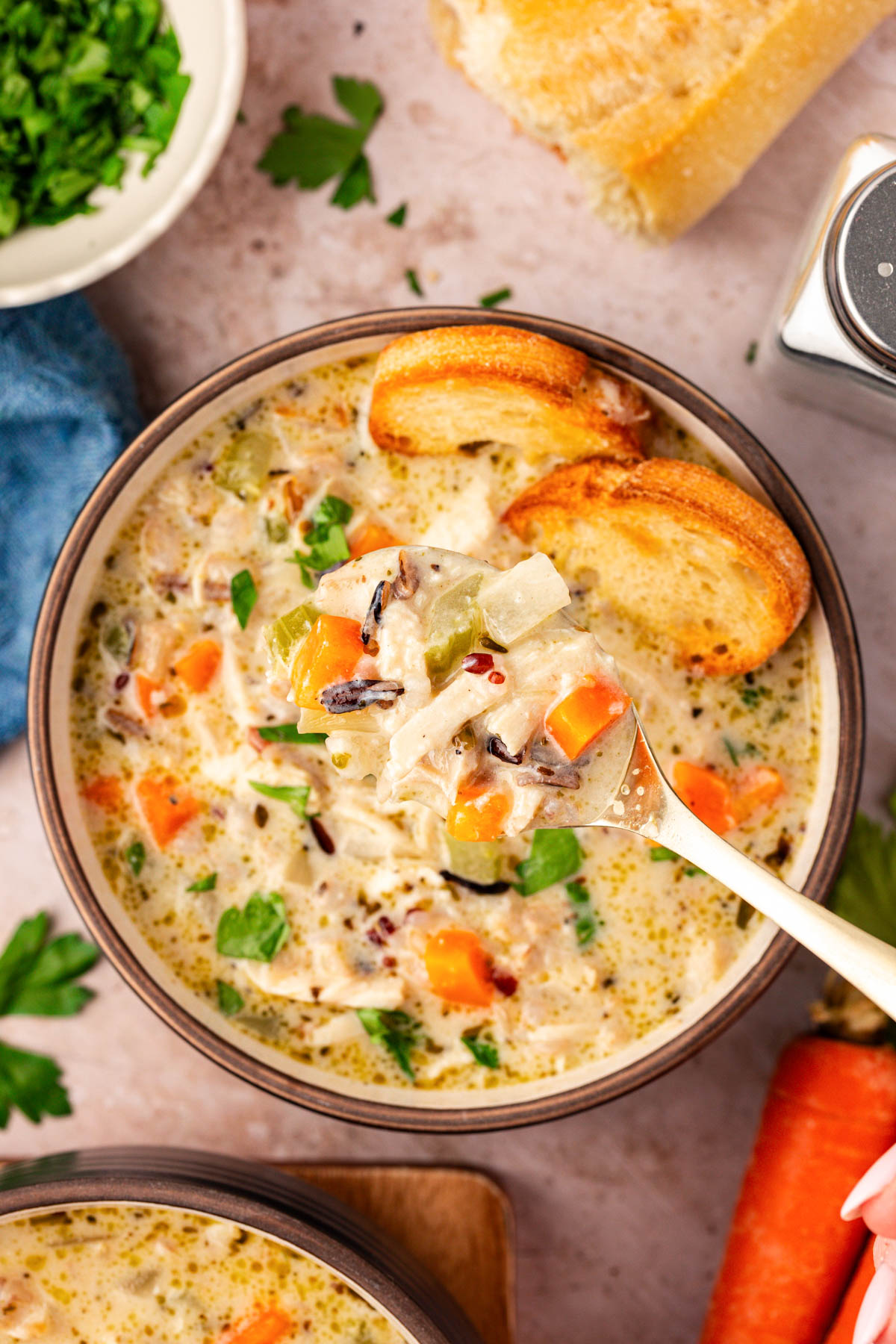 Close up overhead photo of a bowl of chicken and rice soup.