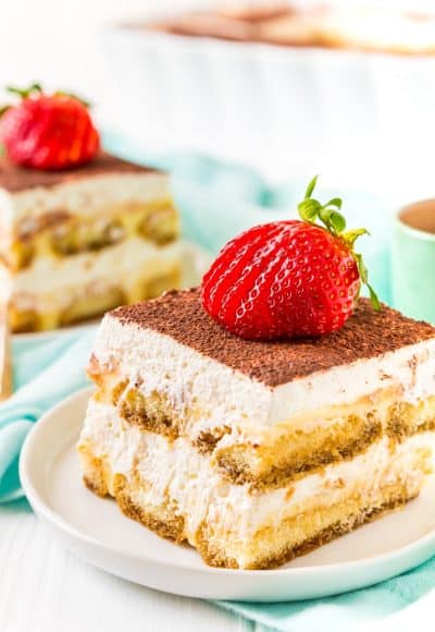 This Boozy Tiramisu recipe swaps out traditional coffee for a rich coffee liqueur. It's a shortcut version made with mascarpone laced pudding instead of a traditional egg custard. Topped with a silky vanilla whipped cream.