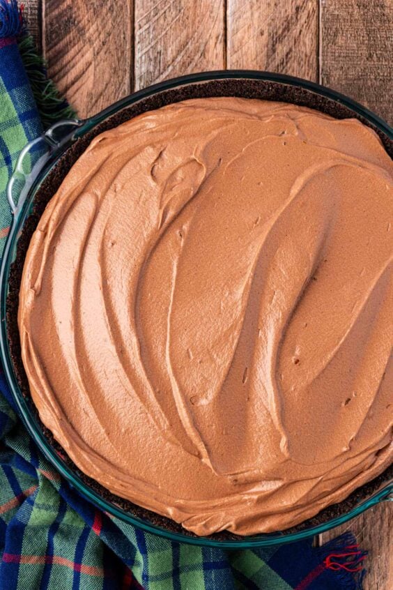 Chocolate pie filling in a oreo crust in a pie dish.