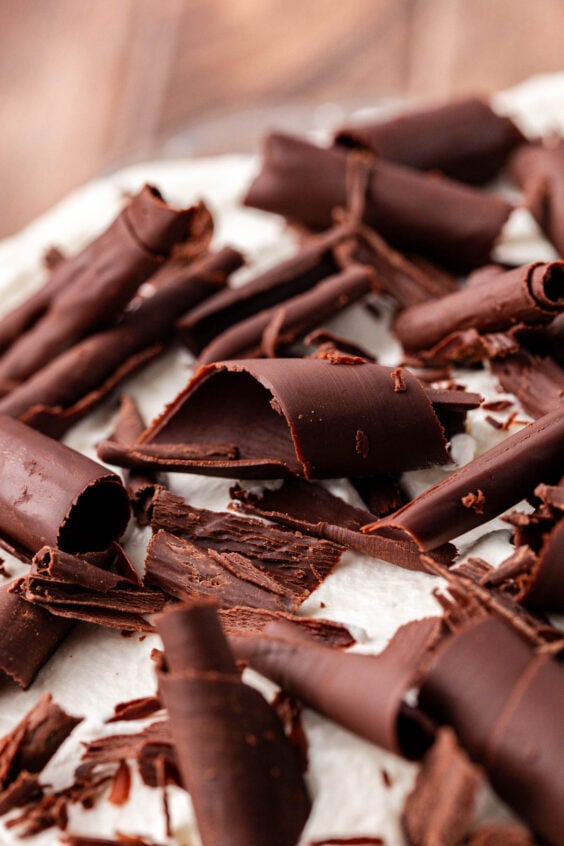 Chocolate curls on a whipped cream topped pie.