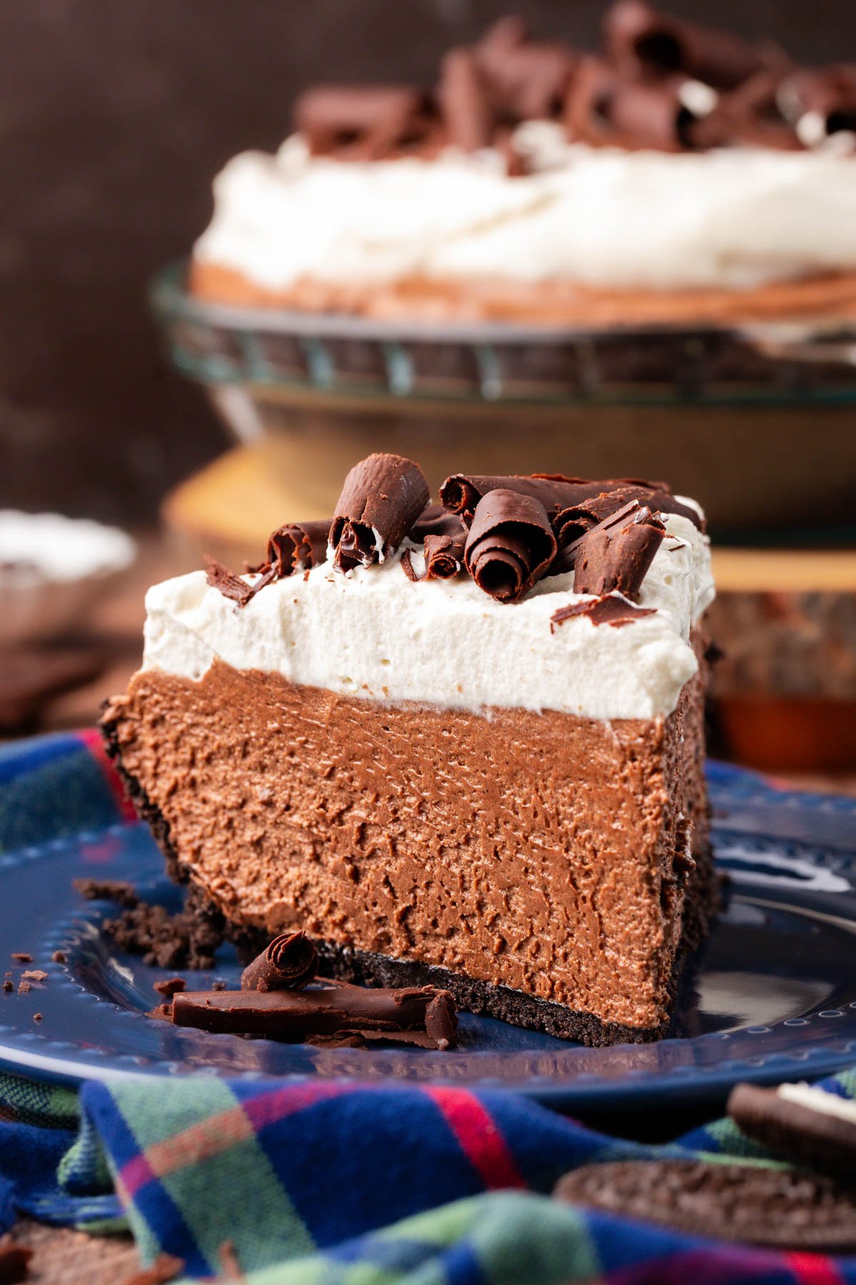 Close up of a slice of French Silk Pie with whipped cream topping.