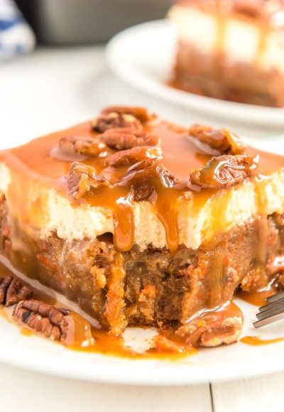 This Sea Salt Caramel Carrot Cake Poke Cake is so sweet and delicious, you'll never want any other carrot cake again! Baked to perfection and saturated in sweetened condensed milk, then topped with fluffy frosting and drenched in caramel sauce.