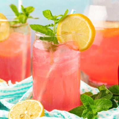 Glasses of homemade pink lemonade on a table.