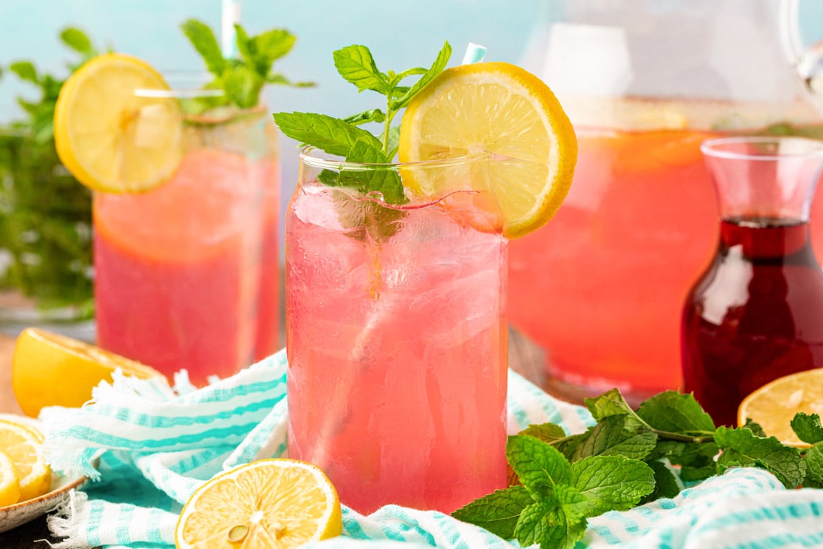 Glasses of homemade pink lemonade on a table.