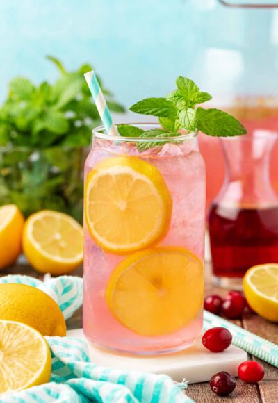 Close up of a glass filled with homemade pink lemonade.