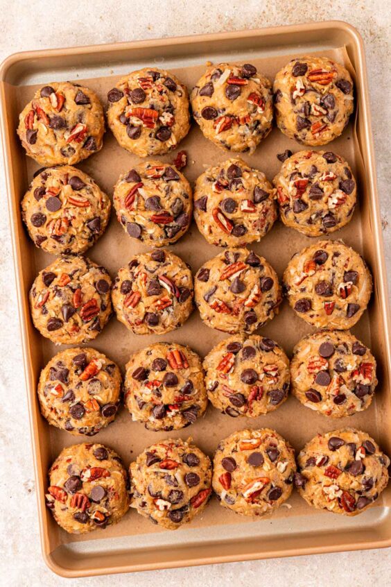 Overhead photo of scoops of cookie dough on a baking sheet ready to chill.