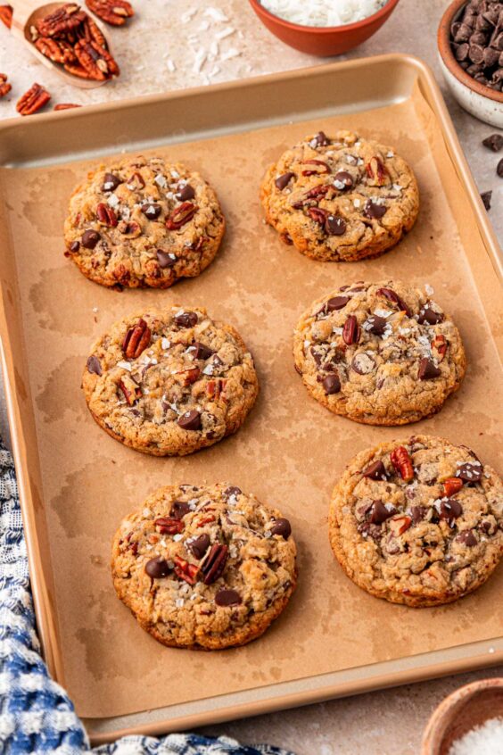 Cowboy cookies on a baking sheet.