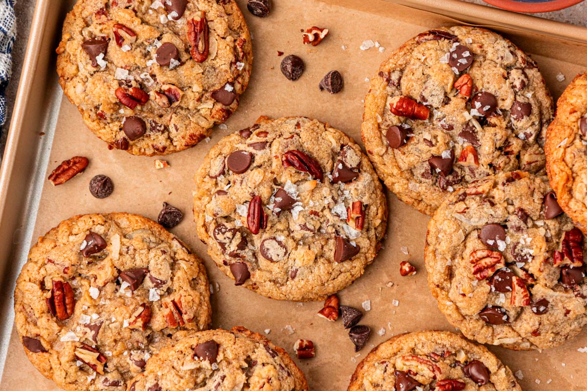 Overhead photo of pecan chocolate chip oatmeal cookies on a sheet pan.