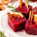 Christmas Ice Cubes made with pomegranate juice on a plate.