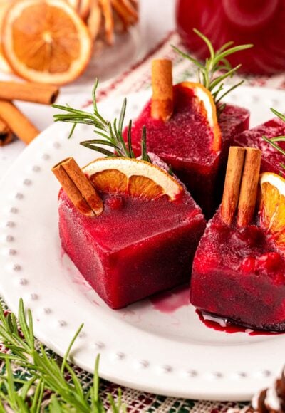 Christmas Ice Cubes made with pomegranate juice on a plate.