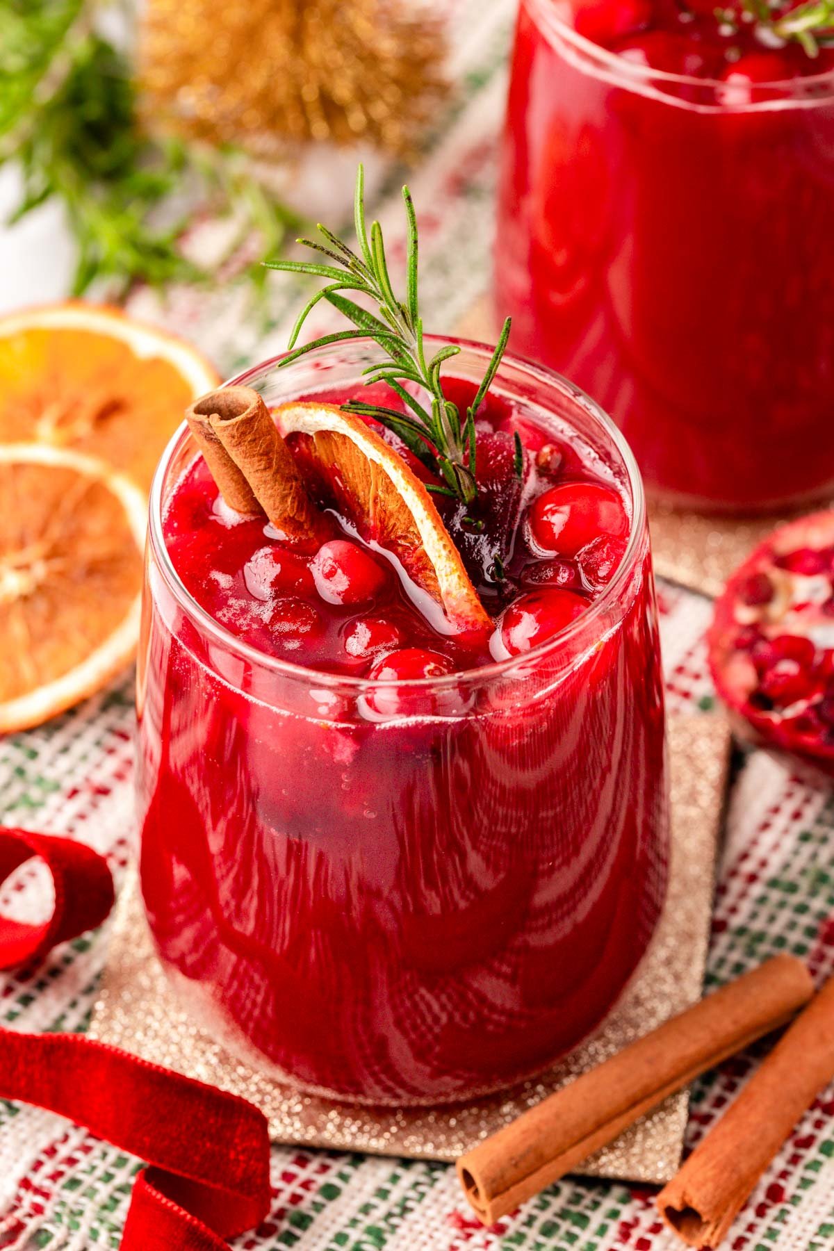 Close up of a glass of holiday punch on a table.