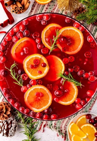 Overhead photo of a bowl of Christmas Punch on a table ready for a party.