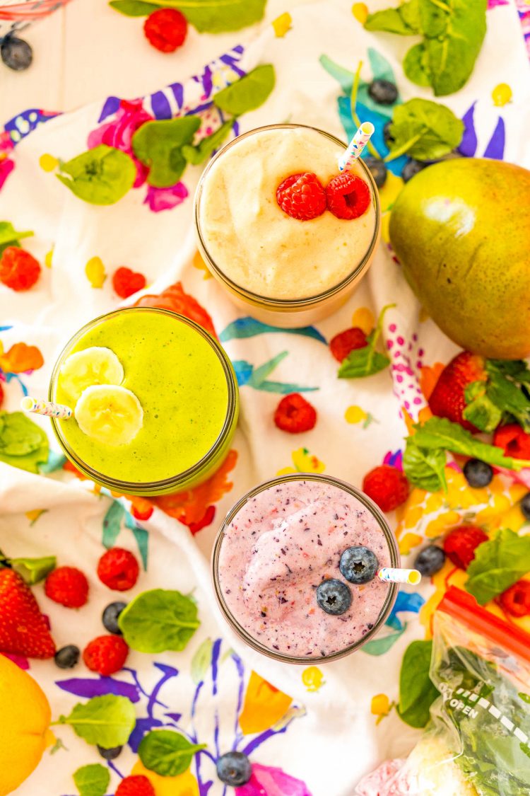 Overhead photo of smoothies surrounded by fruit