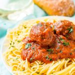 Meatballs on a plate of spaghetti.