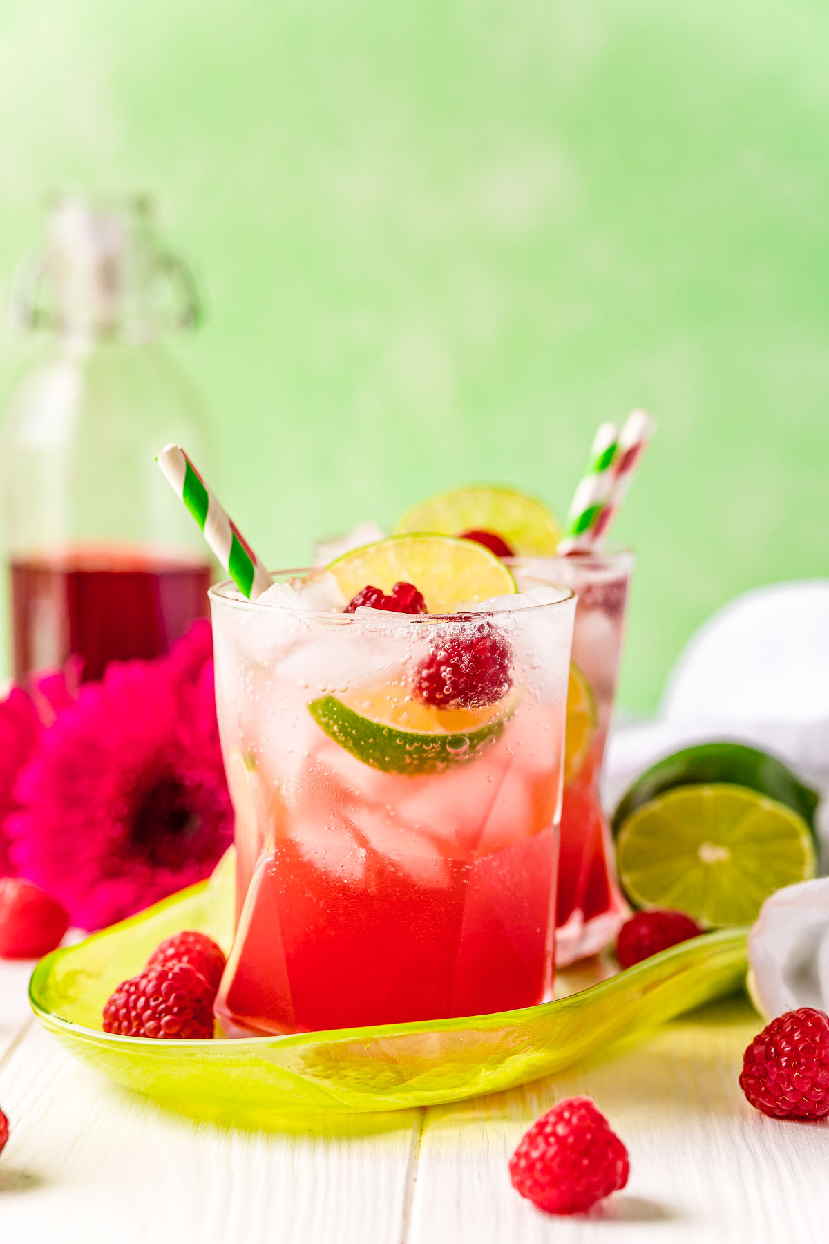 Raspberry lime rickeys on a green serving tray.