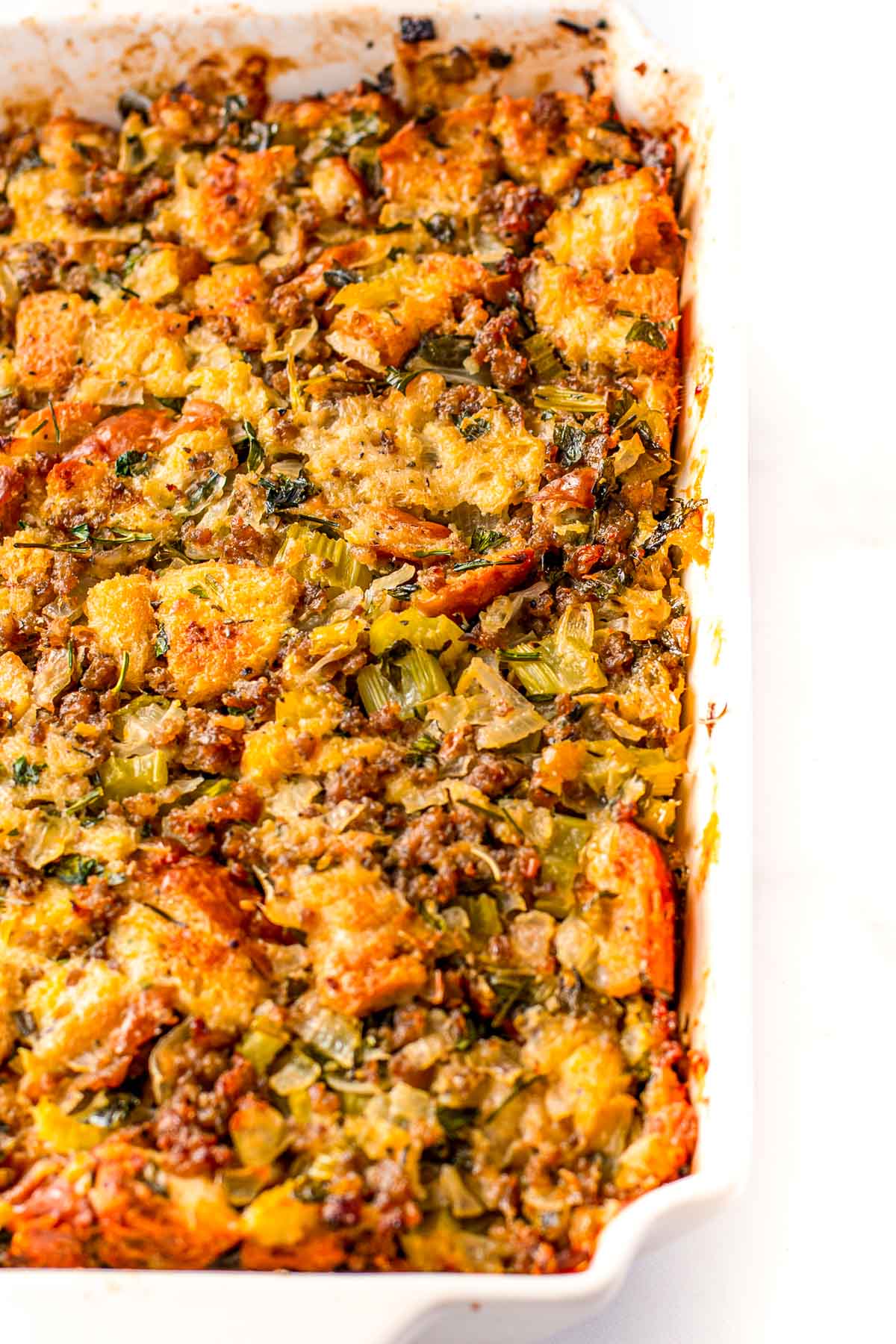 Overhead close up photo of a baking dish filled with sausage dressing.