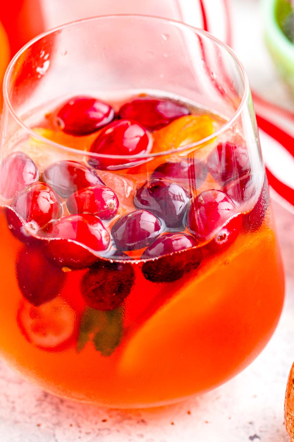 Close up photo of a glass filled with christmas punch.