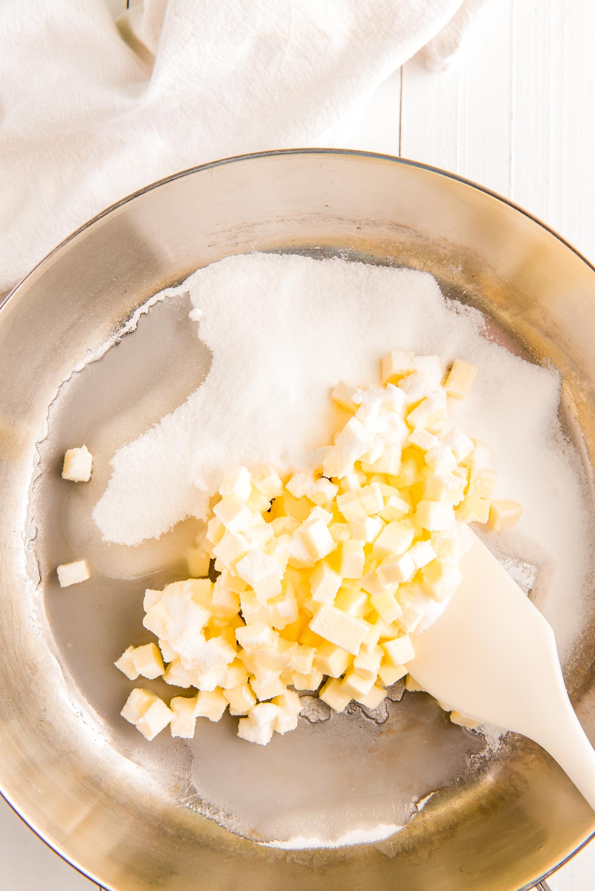 Butter and sugar in a stainless steel saucepan.