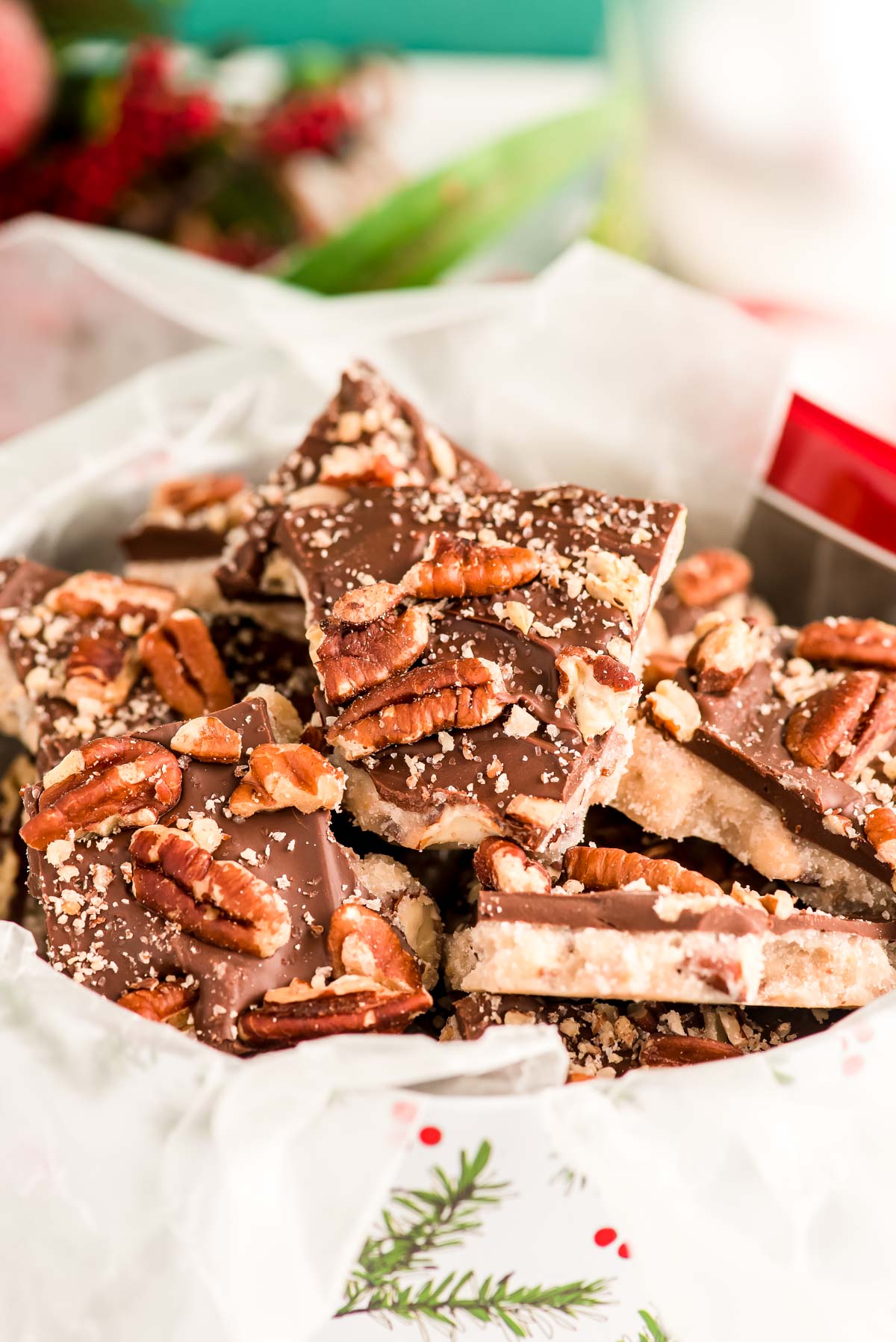 Close up photo of butter toffee in a christmas tin.