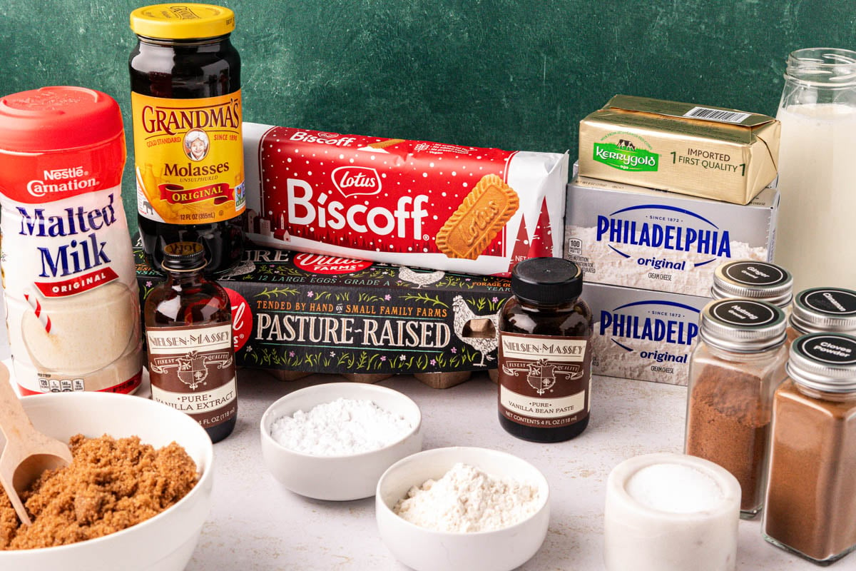 Ingredients to make gingerbread cheesecake on a table.