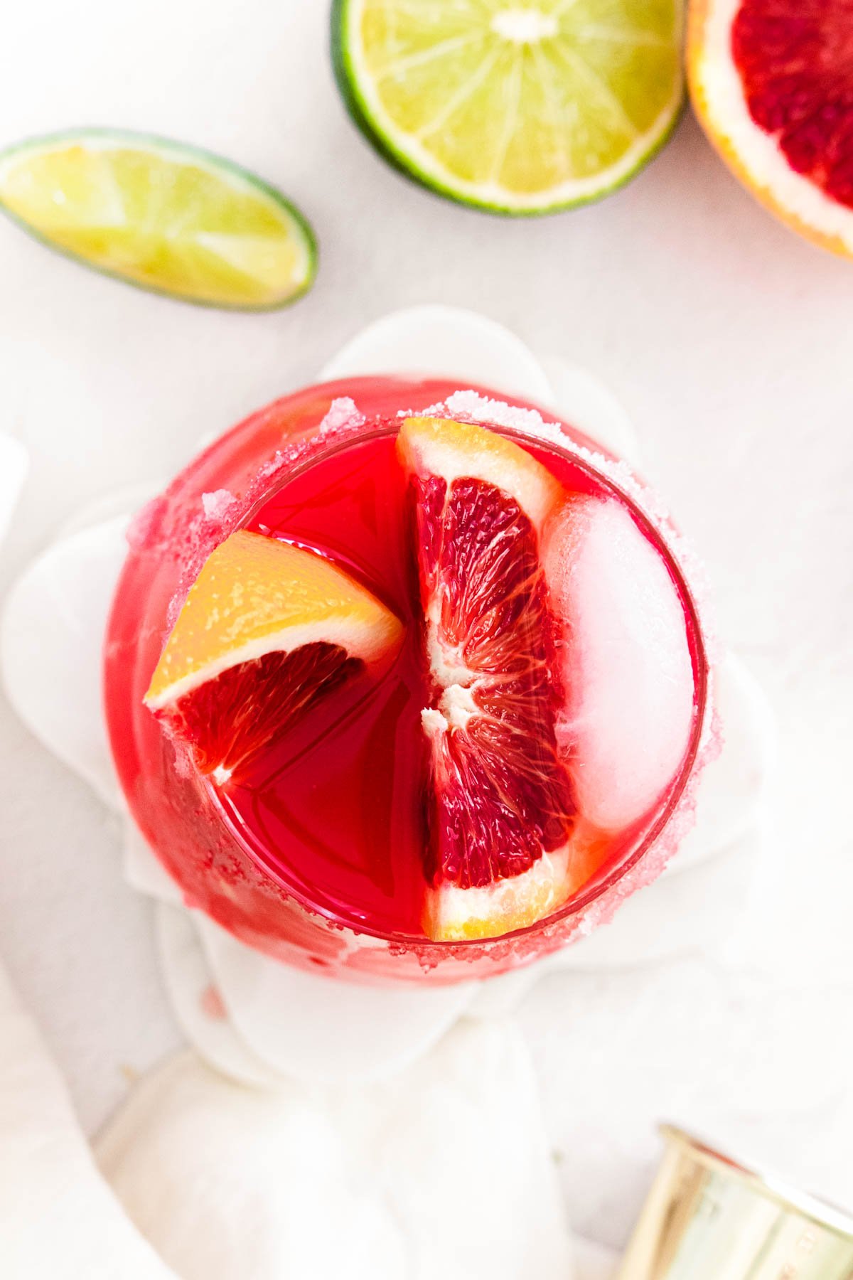 Overhead photo of a red cocktail garnish with blood orange.