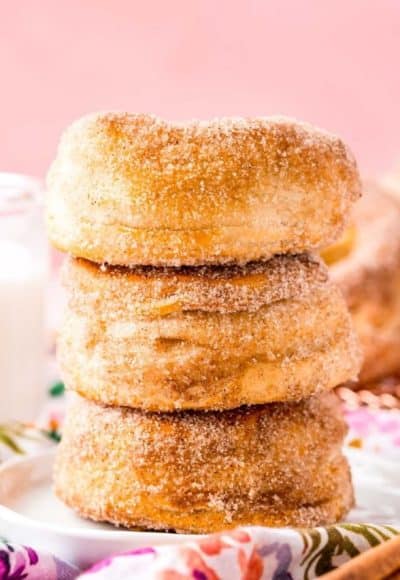 These Air Fryer Donuts are super easy donuts that are ready in just 20 minutes using canned biscuits and then dipped in cinnamon-sugar or topped with a classic sweet glaze!