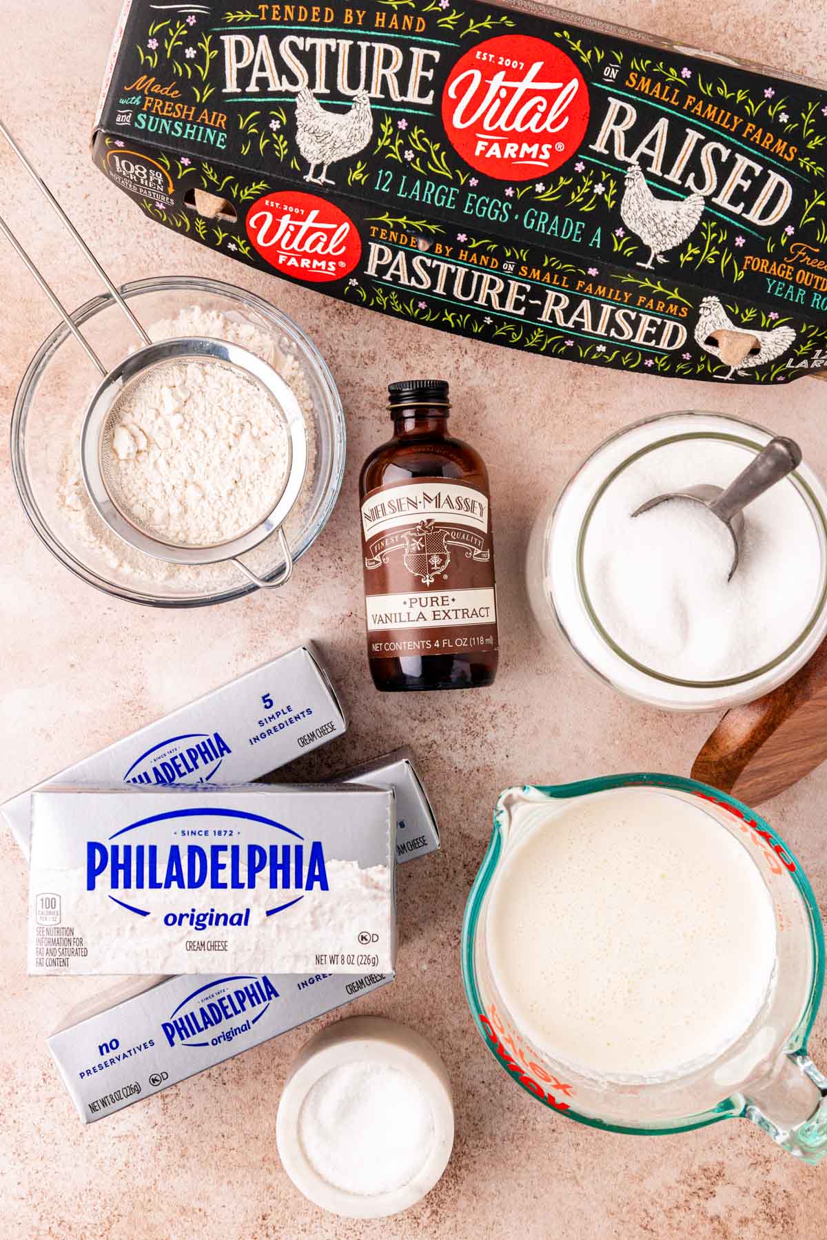 Overhead photo of ingredients to make basque cheesecake on a table.