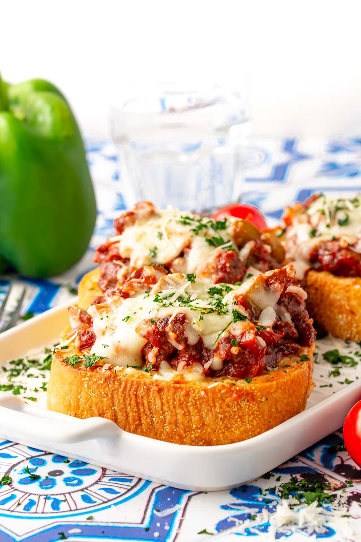 Close up photo of Texas toast sloppy joes on a white plate.