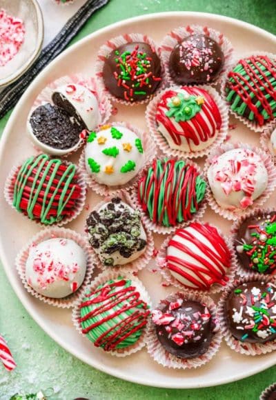 Overhead photo of Christmas decorated Oreo Balls on a white plate.