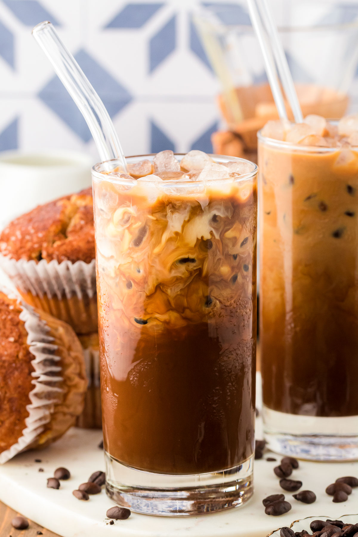 Iced coffee in jar, mug glass cup on the white table Stock Photo