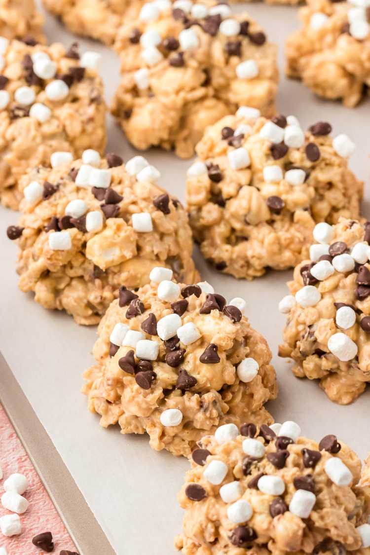 Avalanche cookies on a parchment paper lined baking sheet to set.