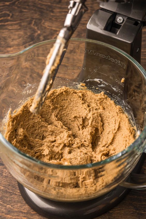 Butter and sugar creamed together in a stand mixer bowl.