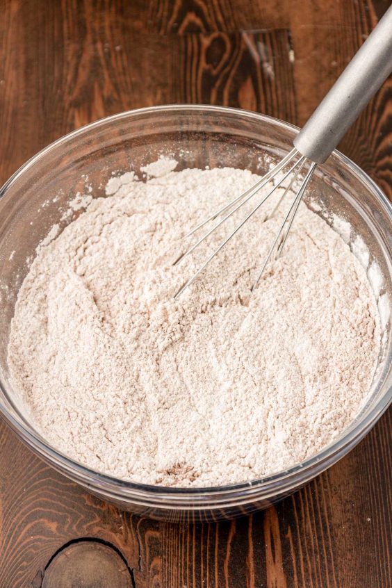 Dry ingredients being whisked together for pumpkin cookie dough.