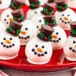 Snowman Oreo Truffles on a red plate.