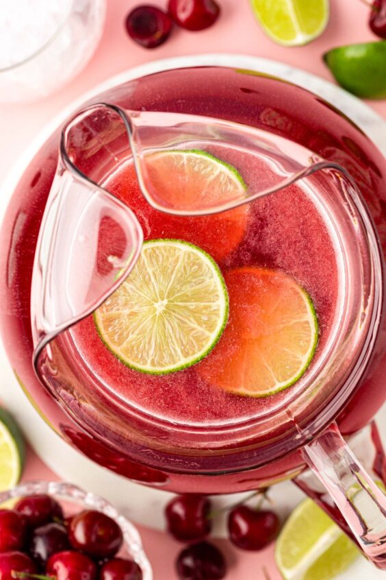 Overhead photo of a pitcher of cherry limeade.