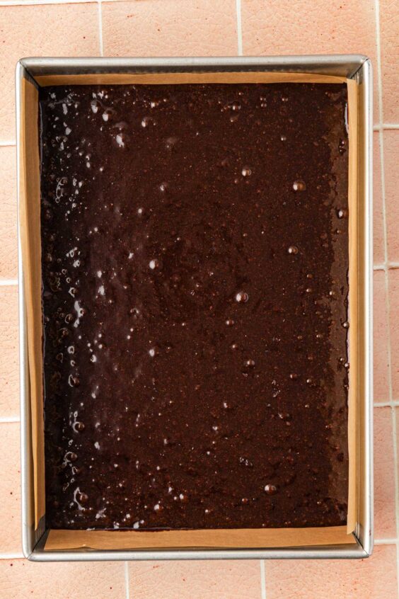 Brownie batter in a 9x13-inch pan.