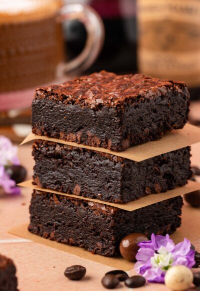 Close up of a stack of three coffee brownies.
