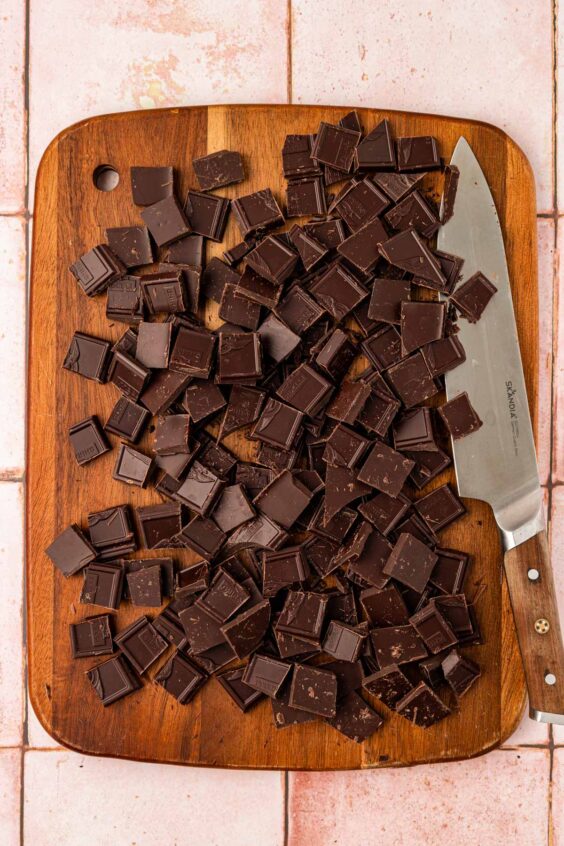 Chopped Chocolate on a cutting board.