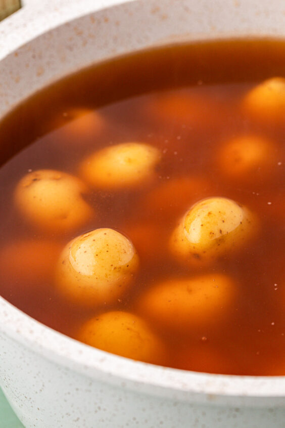 Baby potatoes boiling in seasoned water.