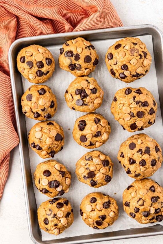 Overhead balls of cookie dough on a pan.